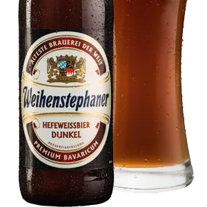 Bottle of beer with a Weihenstephaner label that has a coat of arms on it.
