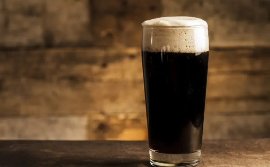 A glass of dark beer