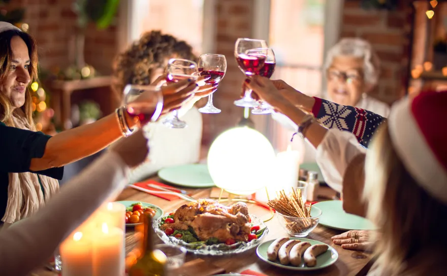Group of women toasting over roast turkey