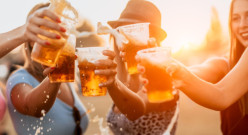 Female friends toasting with beer