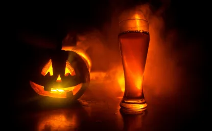 A jack-o-lantern and a beer